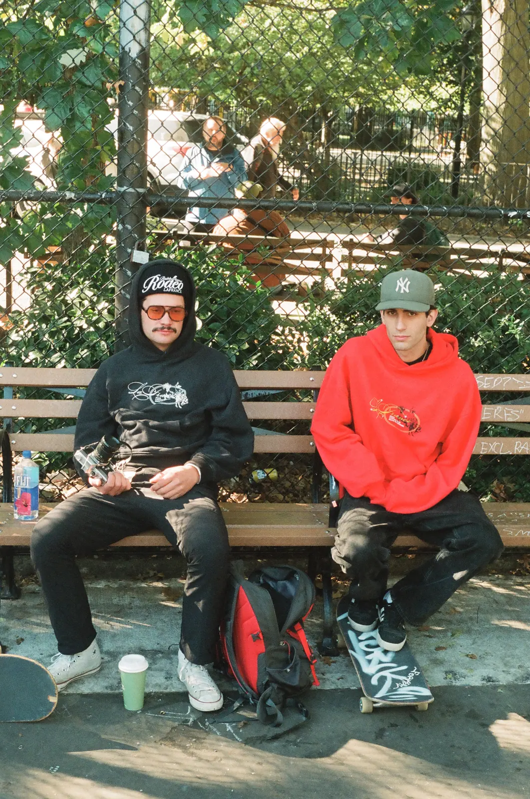 Two friends sitting together on a bench