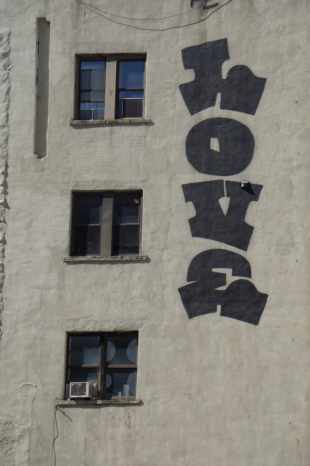 Painted letters on a weathered building