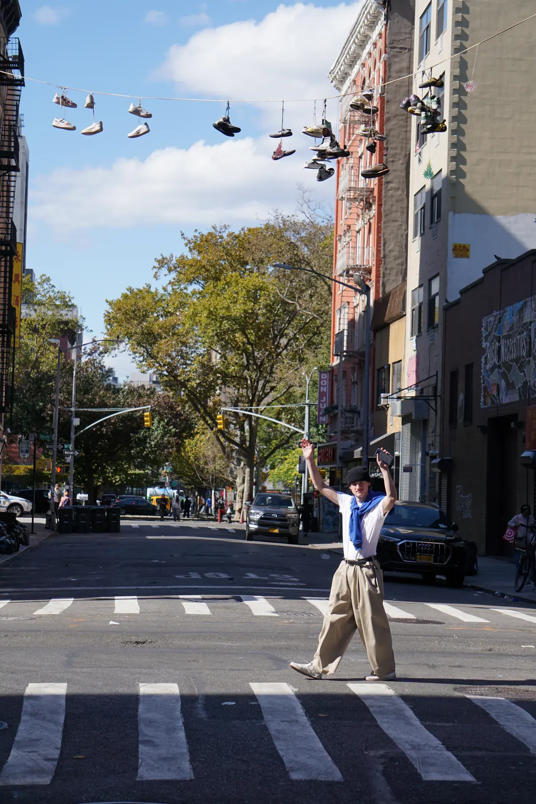 Person posing in the middle of a city street