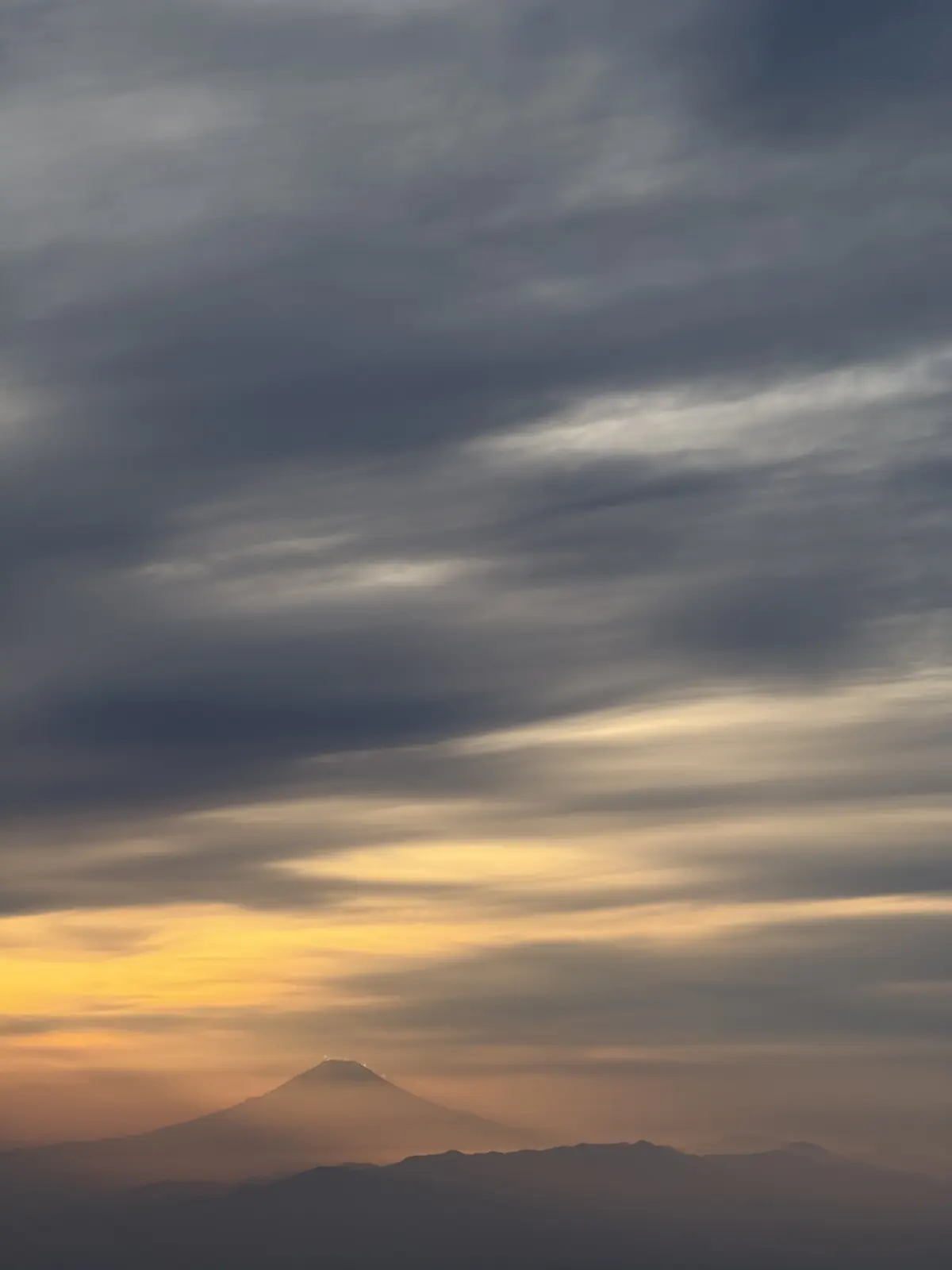 Dark clouds over a distant horizon
