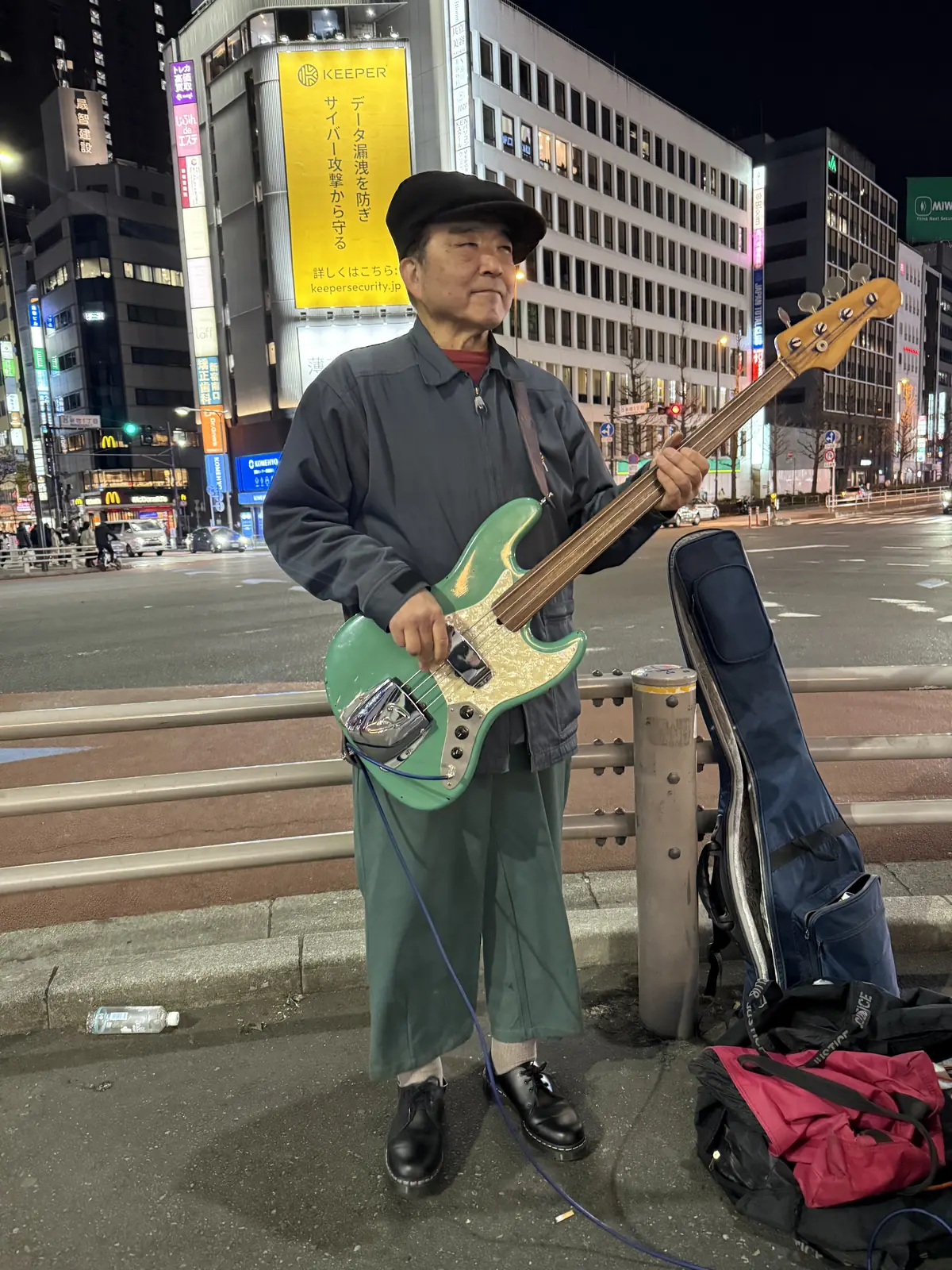 Musician playing guitar on a city street
