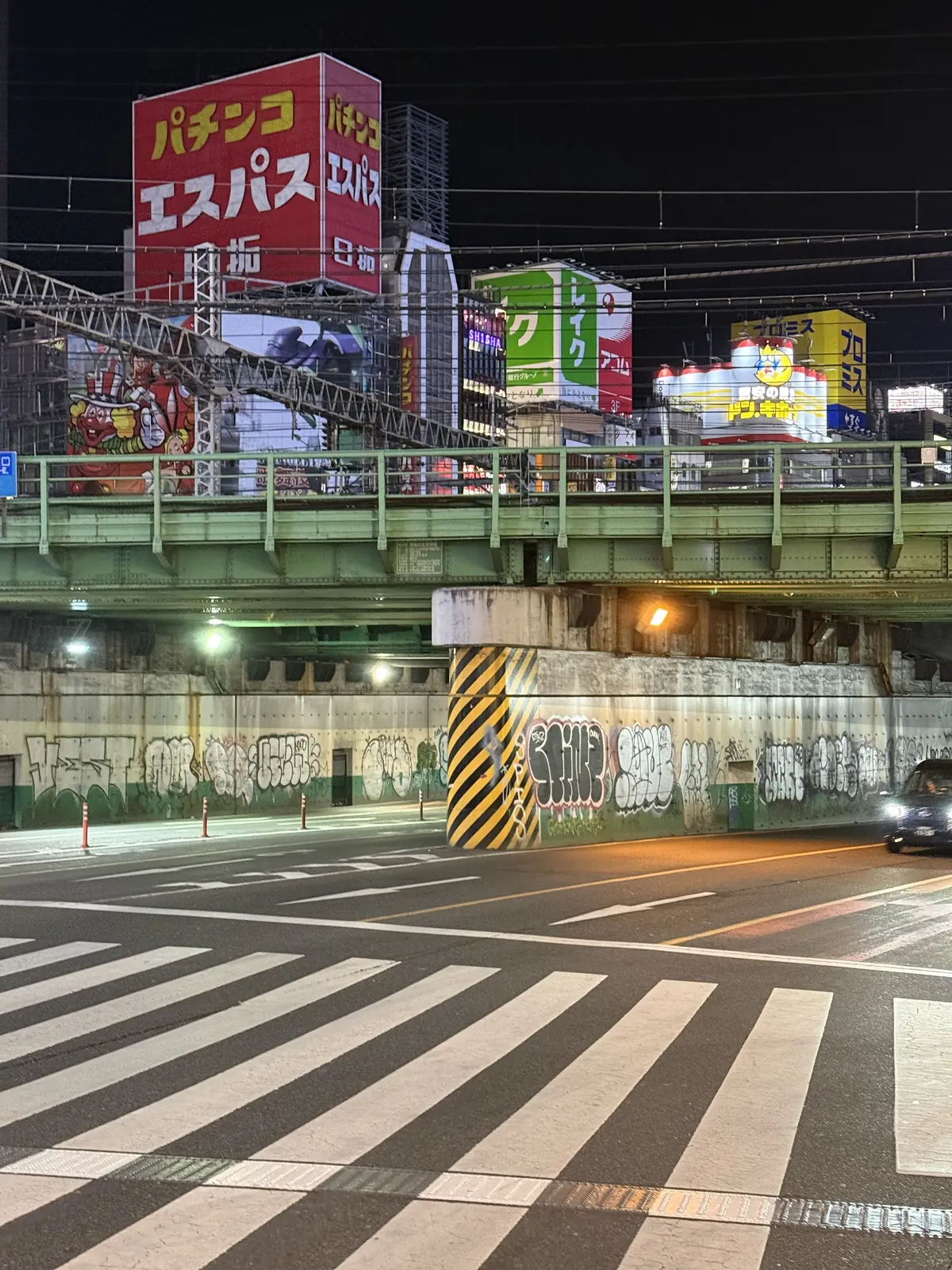 Illuminated city intersection at night