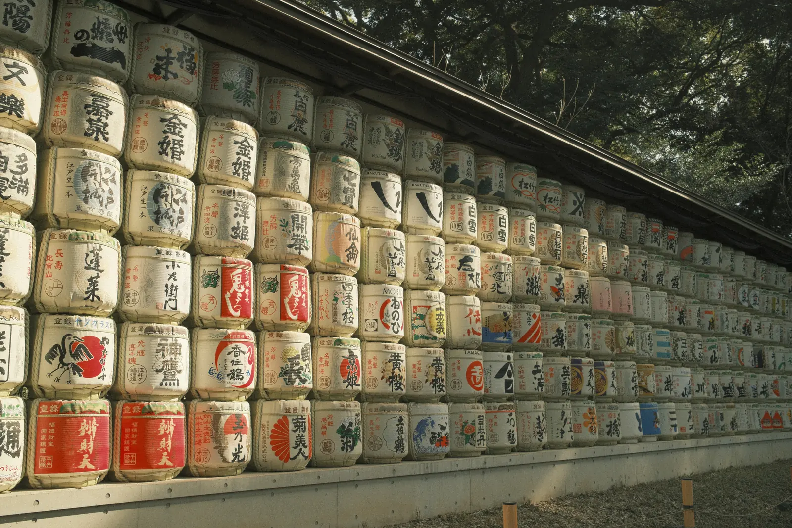 Rows of decorated sake barrels in Japan