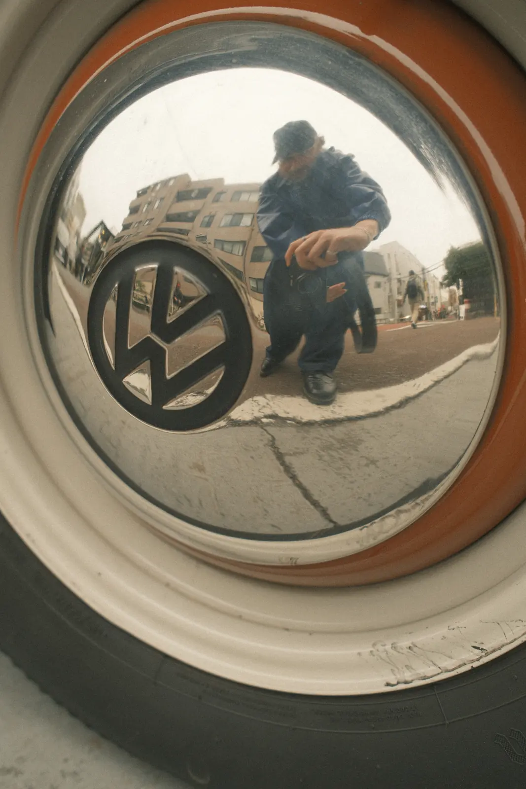 Volkswagen emblem reflected in a curved surface