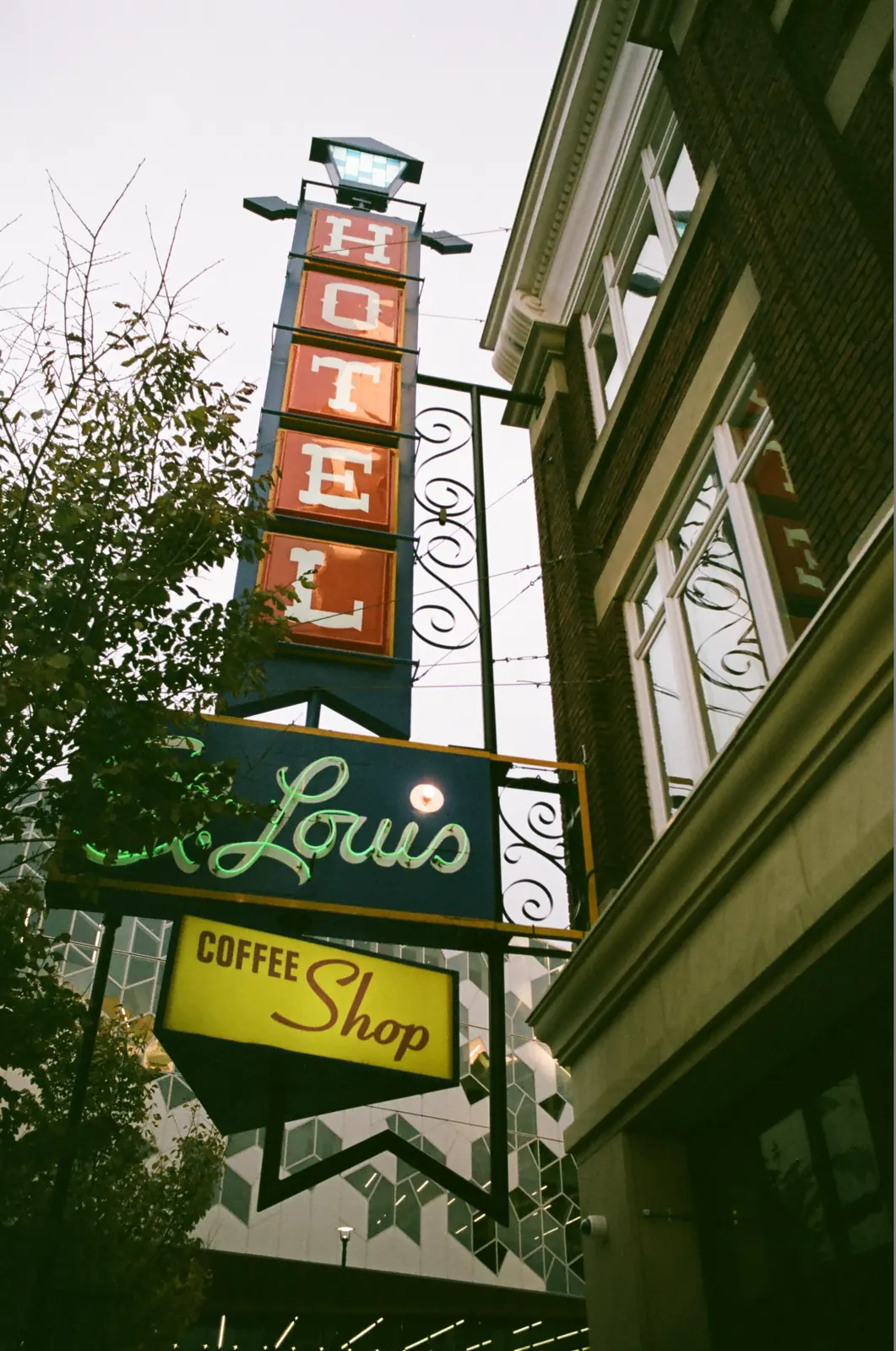 Layered storefront signs viewed from the street